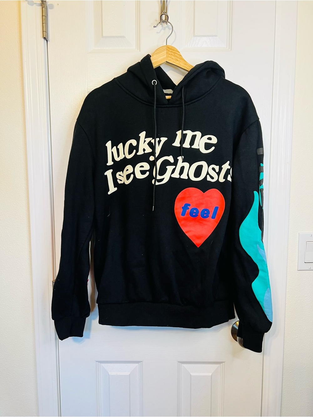 Black Graphic Crewneck Sweater with Red Heart and Teal Sleeve Accent